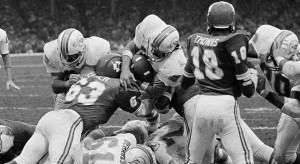 Miami's Jim Kiick gets to the less-then-a-foot line before being stopped by Kansas City's Willie Lanier (63) in the playoff game with the Chiefs. On the next play, Kiick scored for the Dolphins. Miami beat Kansas City 27-24 in an overtime period on Dec. 25, 1971 in Kansas City. (AP Photo)